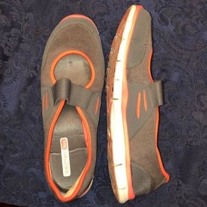 Pink and gray Sketchers flex walking shoes.